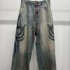 BALENCIAGA TATTOO BUGGY JEANS